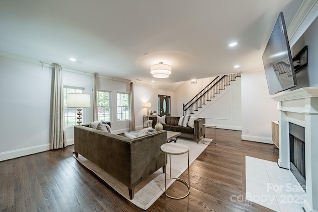 1121 S Wendover Rd, Charlotte, NC 28211 - living room featuring stairs, dark wood-type flooring, baseboards, ornamental molding, and recessed lighting
