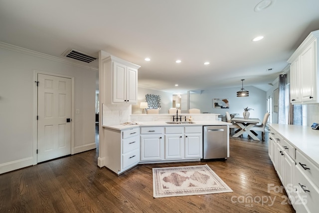 1121 S Wendover Rd, Charlotte, NC 28211 - kitchen featuring stainless steel dishwasher, a sink, a peninsula, white cabinetry, and recessed lighting