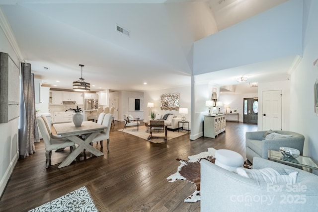 1121 S Wendover Rd, Charlotte, NC 28211 - living room featuring dark wood-type flooring, recessed lighting, ornamental molding, and baseboards
