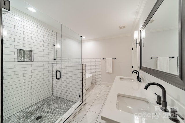 1121 S Wendover Rd, Charlotte, NC 28211 - bathroom with a stall shower, crown molding, double vanity, a freestanding tub, and recessed lighting