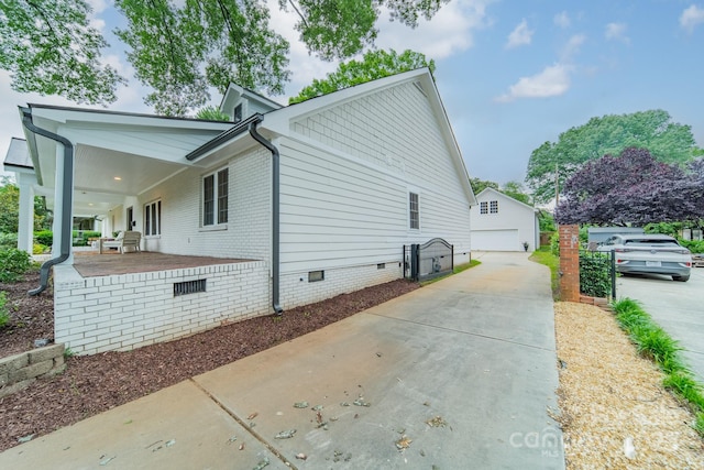 1121 S Wendover Rd, Charlotte, NC 28211 - view of property exterior with crawl space, a detached garage, and an outdoor structure