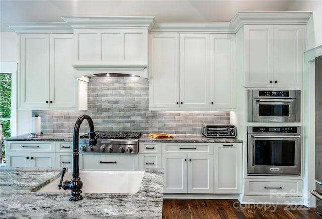 1003 Glory Dr Unit 60, Morganton, NC 28655 - kitchen featuring a sink, white cabinetry, and light stone countertops