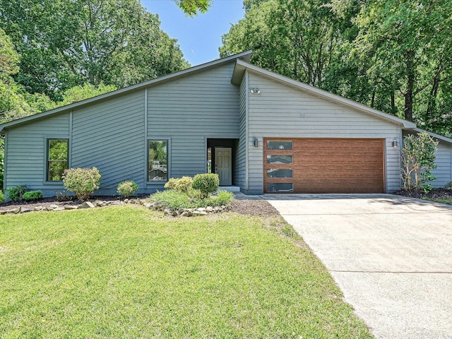 3531 Bon Rea Dr, Charlotte, NC 28226 - mid-century modern home with concrete driveway, an attached garage, and a front lawn