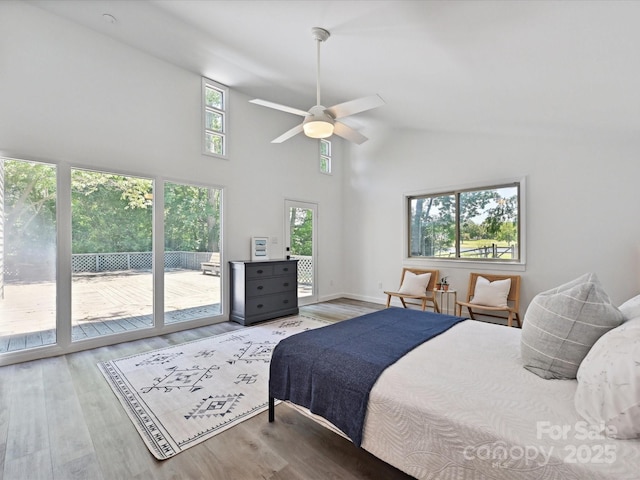 3531 Bon Rea Dr, Charlotte, NC 28226 - bedroom featuring access to outside, multiple windows, wood finished floors, high vaulted ceiling, and ceiling fan