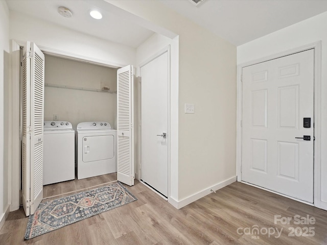 3531 Bon Rea Dr, Charlotte, NC 28226 - washroom with washer and dryer, light wood finished floors, and baseboards