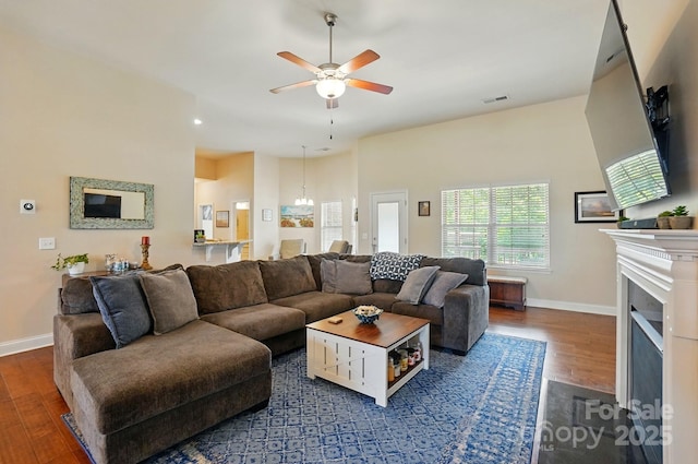 141 Tall Fern Loop, Mooresville, NC 28117 - living room with wood finished floors, ceiling fan, baseboards, and a fireplace with flush hearth
