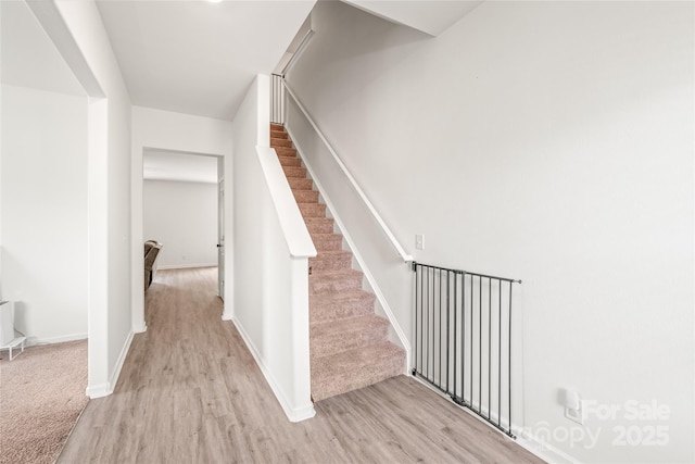 2340 Lanza Dr, Charlotte, NC 28215 - stairway featuring wood finished floors and baseboards