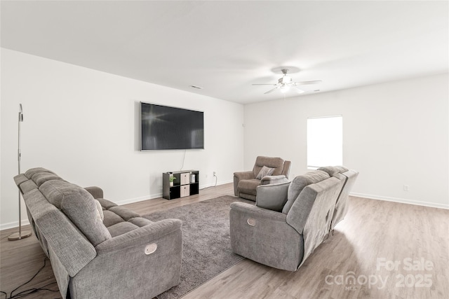2340 Lanza Dr, Charlotte, NC 28215 - living area with light wood finished floors, baseboards, and ceiling fan