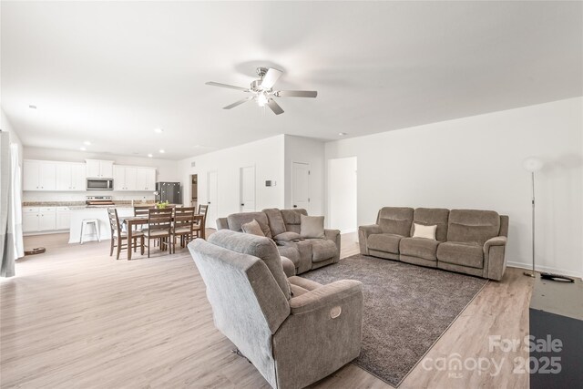 2340 Lanza Dr, Charlotte, NC 28215 - living room with light wood-type flooring, ceiling fan, and recessed lighting