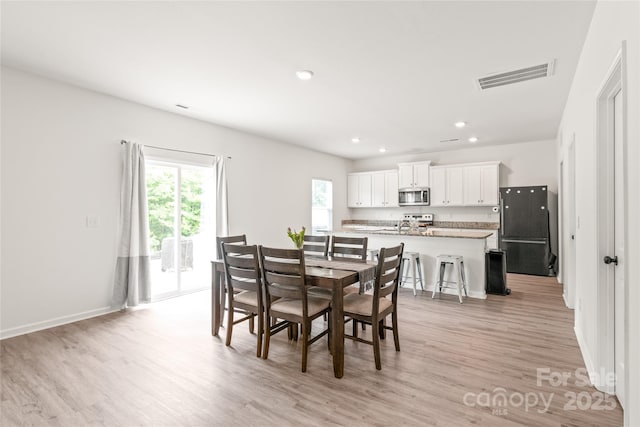 2340 Lanza Dr, Charlotte, NC 28215 - dining area featuring light wood-type flooring, recessed lighting, and baseboards