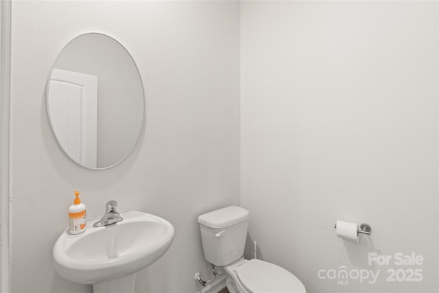 2340 Lanza Dr, Charlotte, NC 28215 - half bath featuring a sink and toilet