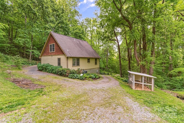 32 Evita Cove Rd, Weaverville, NC 28787 - view of home's exterior with roof with shingles and an outdoor structure