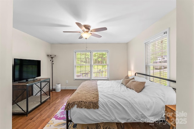 32 Evita Cove Rd, Weaverville, NC 28787 - bedroom featuring wood finished floors, baseboards, and a ceiling fan