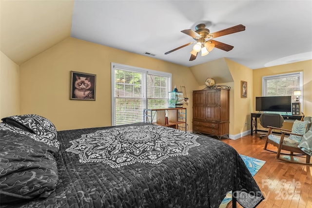 32 Evita Cove Rd, Weaverville, NC 28787 - bedroom with vaulted ceiling, hardwood / wood-style flooring, and a ceiling fan