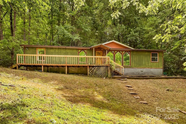 32 Evita Cove Rd, Weaverville, NC 28787 - view of front of home with crawl space, a view of trees, and a deck