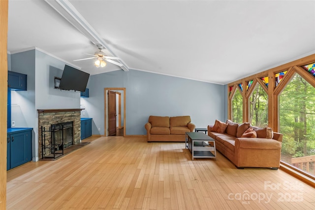 32 Evita Cove Rd, Weaverville, NC 28787 - living room with light wood-style flooring, healthy amount of natural light, a fireplace, and crown molding