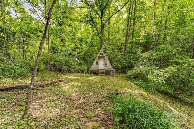 32 Evita Cove Rd, Weaverville, NC 28787 - view of yard with a wooded view and an outdoor structure