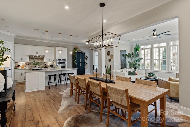 20216 Shaffer Bach Ln, Charlotte, NC 28277 - dining space featuring light wood-style floors, recessed lighting, crown molding, and a ceiling fan