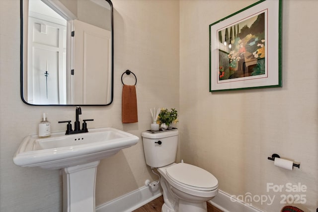 20216 Shaffer Bach Ln, Charlotte, NC 28277 - half bathroom featuring toilet, baseboards, and wood finished floors
