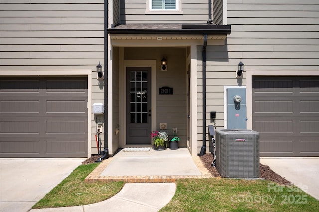 20216 Shaffer Bach Ln, Charlotte, NC 28277 - property entrance with central AC, an attached garage, and concrete driveway