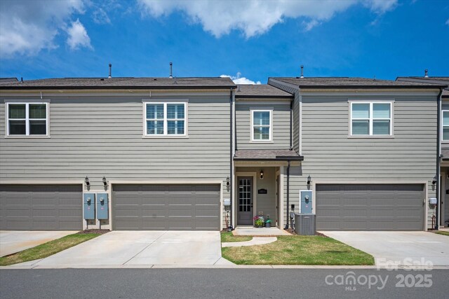 20216 Shaffer Bach Ln, Charlotte, NC 28277 - view of front facade with an attached garage, driveway, and central AC