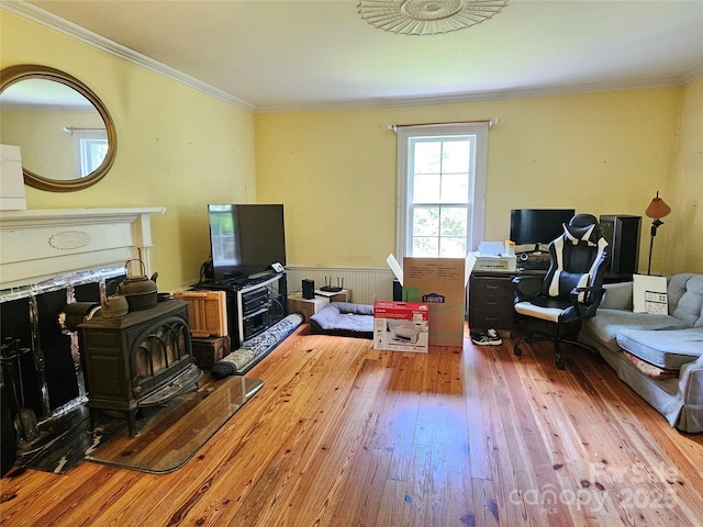 368 Settlemyre Rd, Morganton, NC 28655 - living area featuring hardwood / wood-style flooring, ornamental molding, a wood stove, and an office area