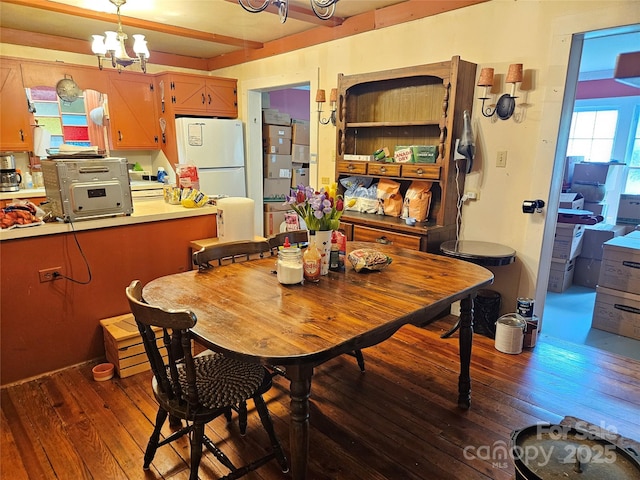 368 Settlemyre Rd, Morganton, NC 28655 - dining room with wood-type flooring and a chandelier