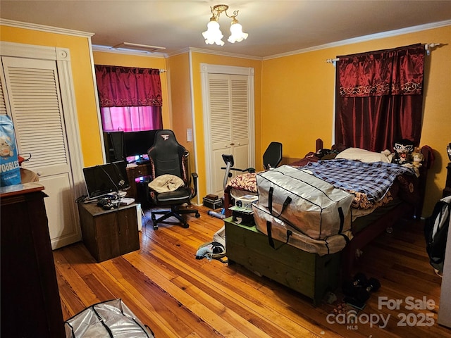 368 Settlemyre Rd, Morganton, NC 28655 - bedroom featuring wood-type flooring, ornamental molding, and a chandelier
