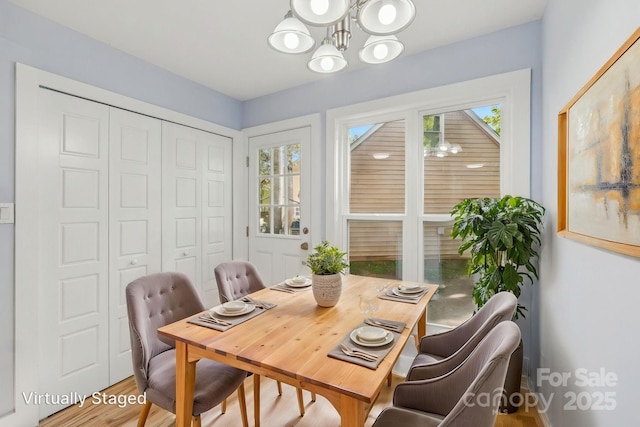 5414 Leaford Ct, Charlotte, NC 28227 - dining space with a chandelier and wood finished floors