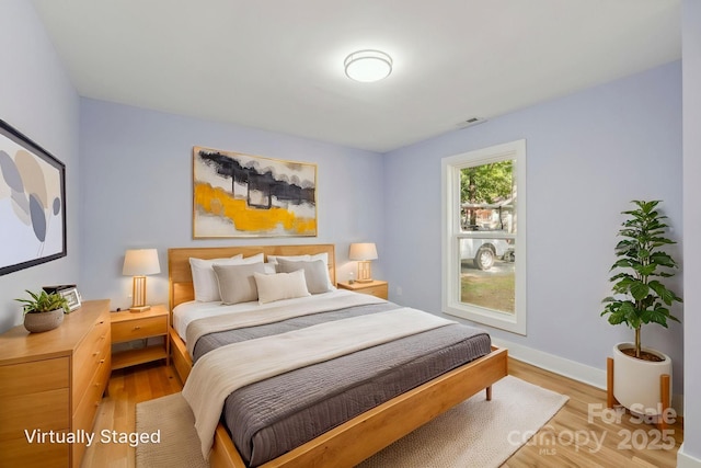 5414 Leaford Ct, Charlotte, NC 28227 - bedroom with light wood-type flooring and baseboards