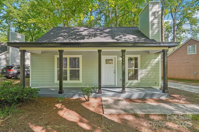 5414 Leaford Ct, Charlotte, NC 28227 - bungalow with a chimney, a porch, and a shingled roof