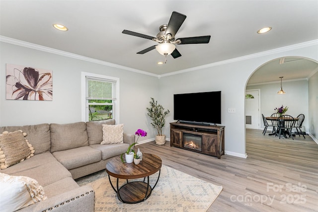 910 W A St, Kannapolis, NC 28081 - living room featuring arched walkways, light wood-style floors, recessed lighting, a ceiling fan, and ornamental molding