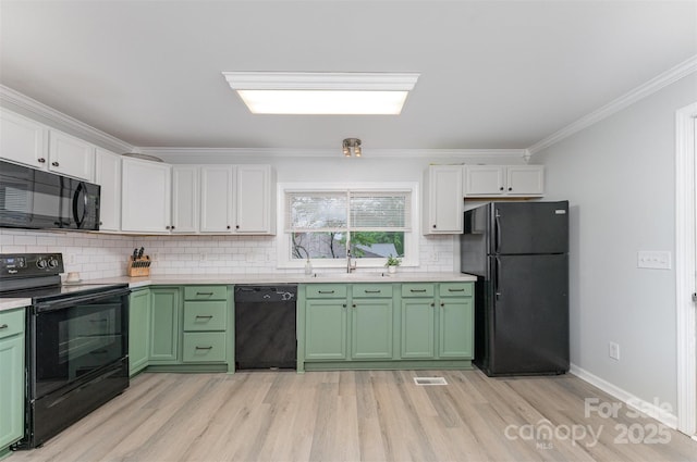 910 W A St, Kannapolis, NC 28081 - kitchen with black appliances, green cabinets, crown molding, and white cabinets