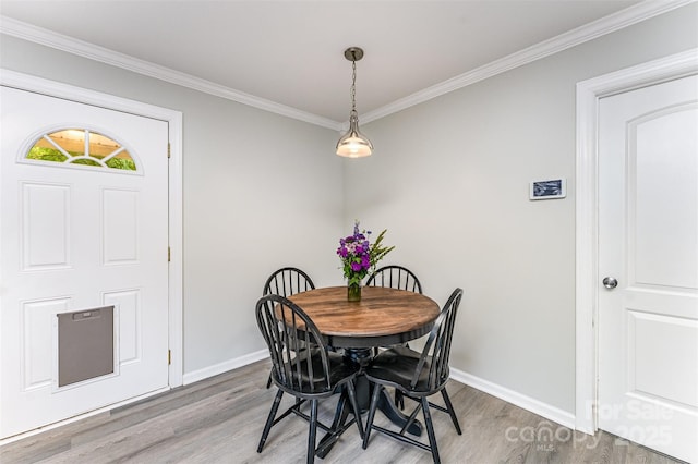 910 W A St, Kannapolis, NC 28081 - dining space featuring light wood finished floors, baseboards, and ornamental molding