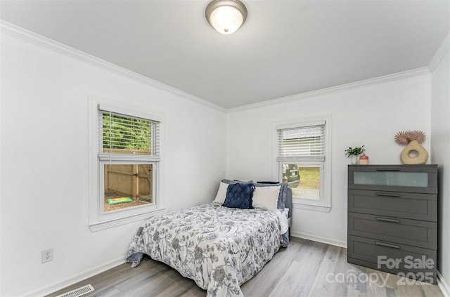 910 W A St, Kannapolis, NC 28081 - bedroom with crown molding, wood finished floors, and baseboards