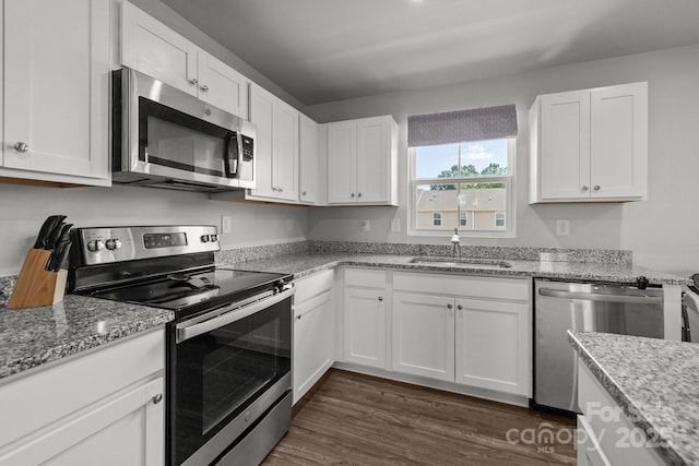 718 Dillon Way Unit 38, Fort Mill, SC 29715 - kitchen with stainless steel appliances, dark wood-style flooring, white cabinets, and light stone countertops
