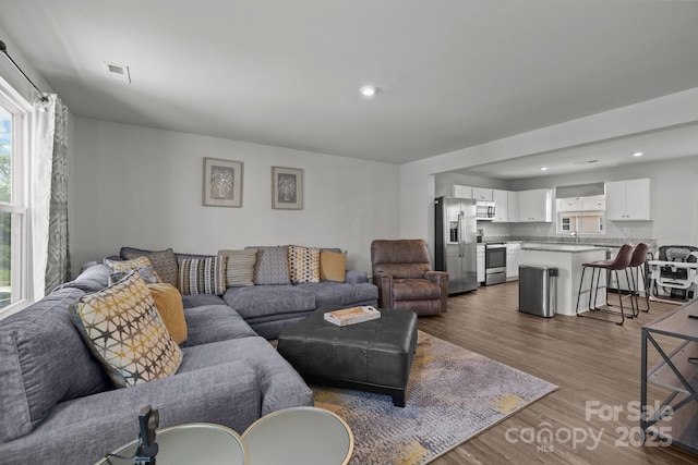 718 Dillon Way Unit 38, Fort Mill, SC 29715 - living area featuring healthy amount of natural light, wood finished floors, and recessed lighting