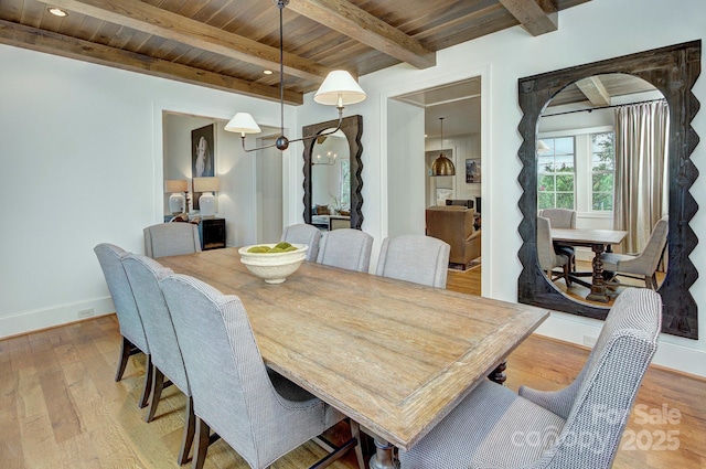 2270 New Gray Rock Rd, Fort Mill, SC 29708 - dining area featuring light wood finished floors, baseboards, wooden ceiling with exposed beams, and arched walkways