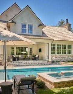 2270 New Gray Rock Rd, Fort Mill, SC 29708 - back of property featuring an outdoor hangout area, an outdoor pool, a patio area, a chimney, and a hot tub