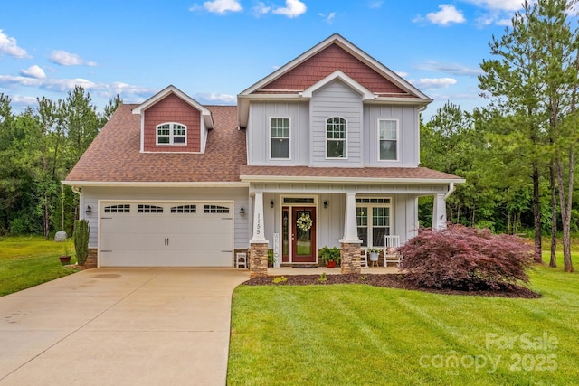 1155 Rudder Cir, Salisbury, NC 28146 - craftsman house with board and batten siding, a front lawn, concrete driveway, and an attached garage