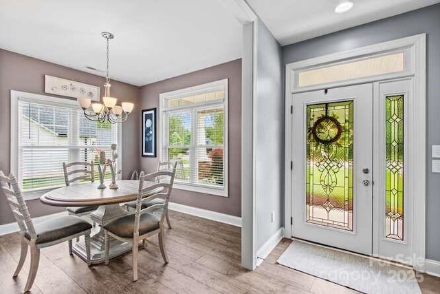 1155 Rudder Cir, Salisbury, NC 28146 - dining space with baseboards, a chandelier, and wood finished floors