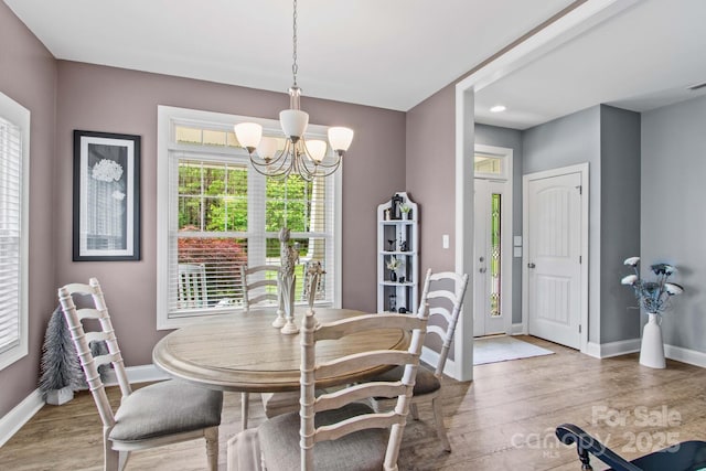 1155 Rudder Cir, Salisbury, NC 28146 - dining room featuring a chandelier, baseboards, and wood finished floors
