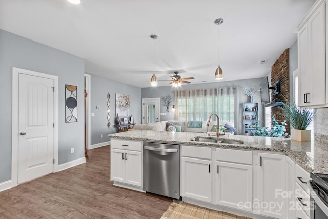 1155 Rudder Cir, Salisbury, NC 28146 - kitchen featuring stainless steel appliances, a sink, a peninsula, ceiling fan, and decorative light fixtures