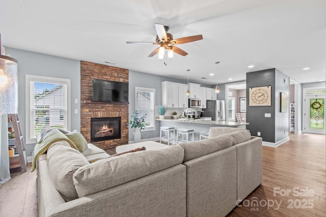 1155 Rudder Cir, Salisbury, NC 28146 - living area featuring baseboards, ceiling fan, light wood-type flooring, healthy amount of natural light, and recessed lighting