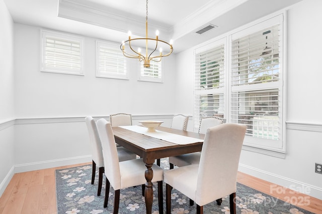 14923 Almondell Dr, Huntersville, NC 28078 - dining room featuring a chandelier, ornamental molding, light wood finished floors, baseboards, and a tray ceiling