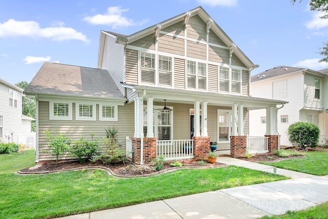 14923 Almondell Dr, Huntersville, NC 28078 - craftsman house with covered porch, a front lawn, and a shingled roof