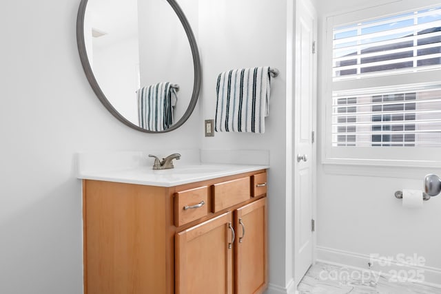 14923 Almondell Dr, Huntersville, NC 28078 - bathroom with vanity, marble look tiles, and baseboards