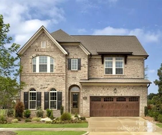 6510 Honeymeade Cir, Charlotte, NC 28277 - view of front of house featuring brick siding, driveway, and an attached garage