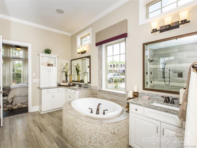 6510 Honeymeade Cir, Charlotte, NC 28277 - bathroom with ornamental molding, two vanities, and healthy amount of natural light
