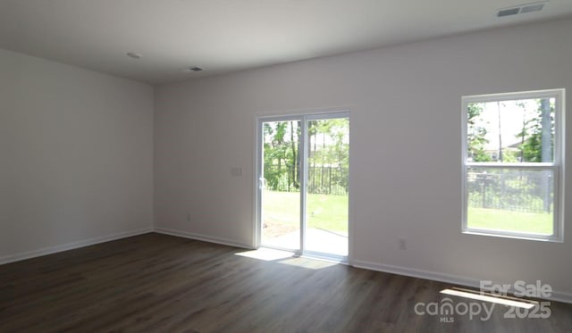 1922 Highland Park Dr, Charlotte, NC 28269 - spare room with dark wood-style flooring and baseboards